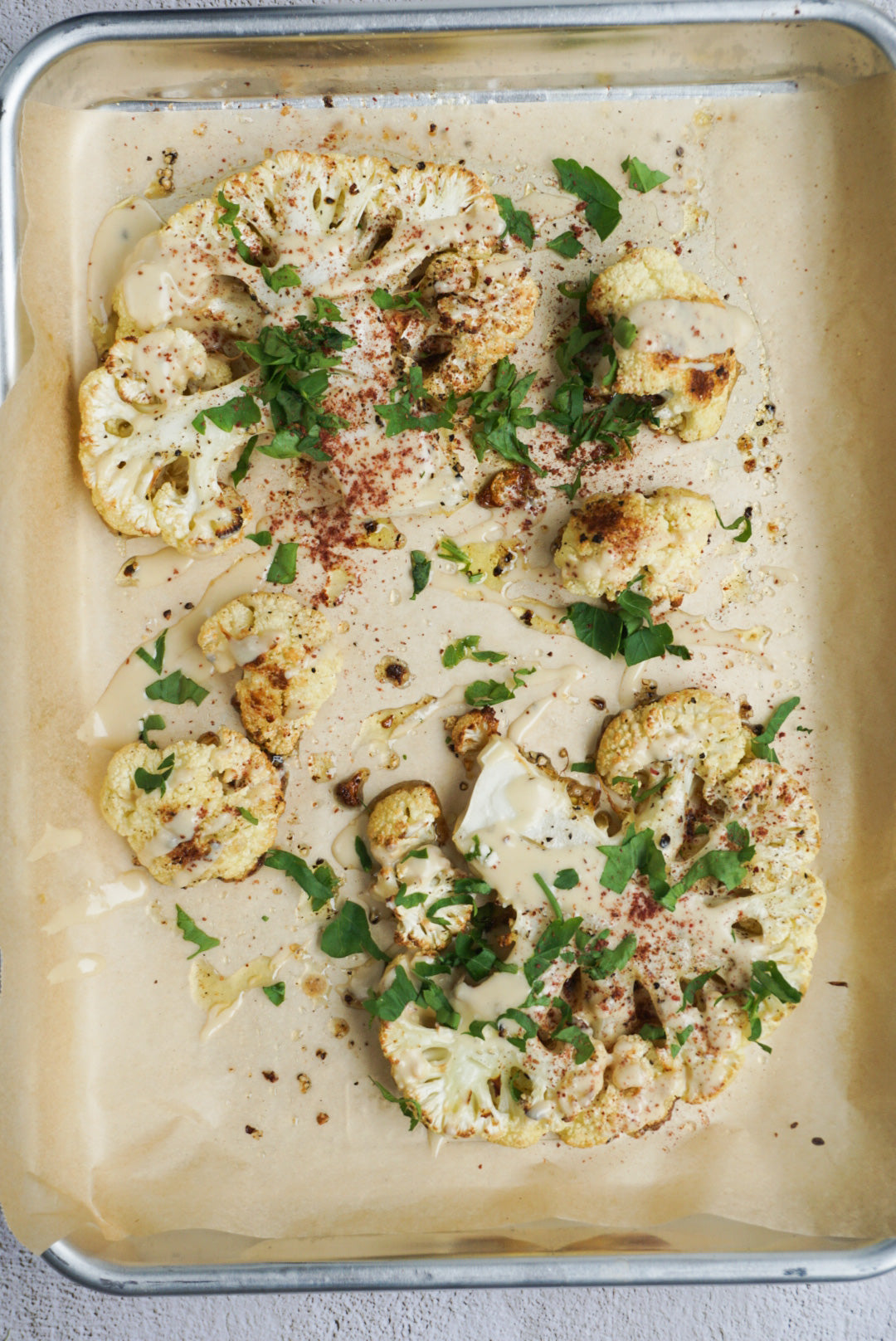 Baked Cauliflower Steaks with Tahini dressing